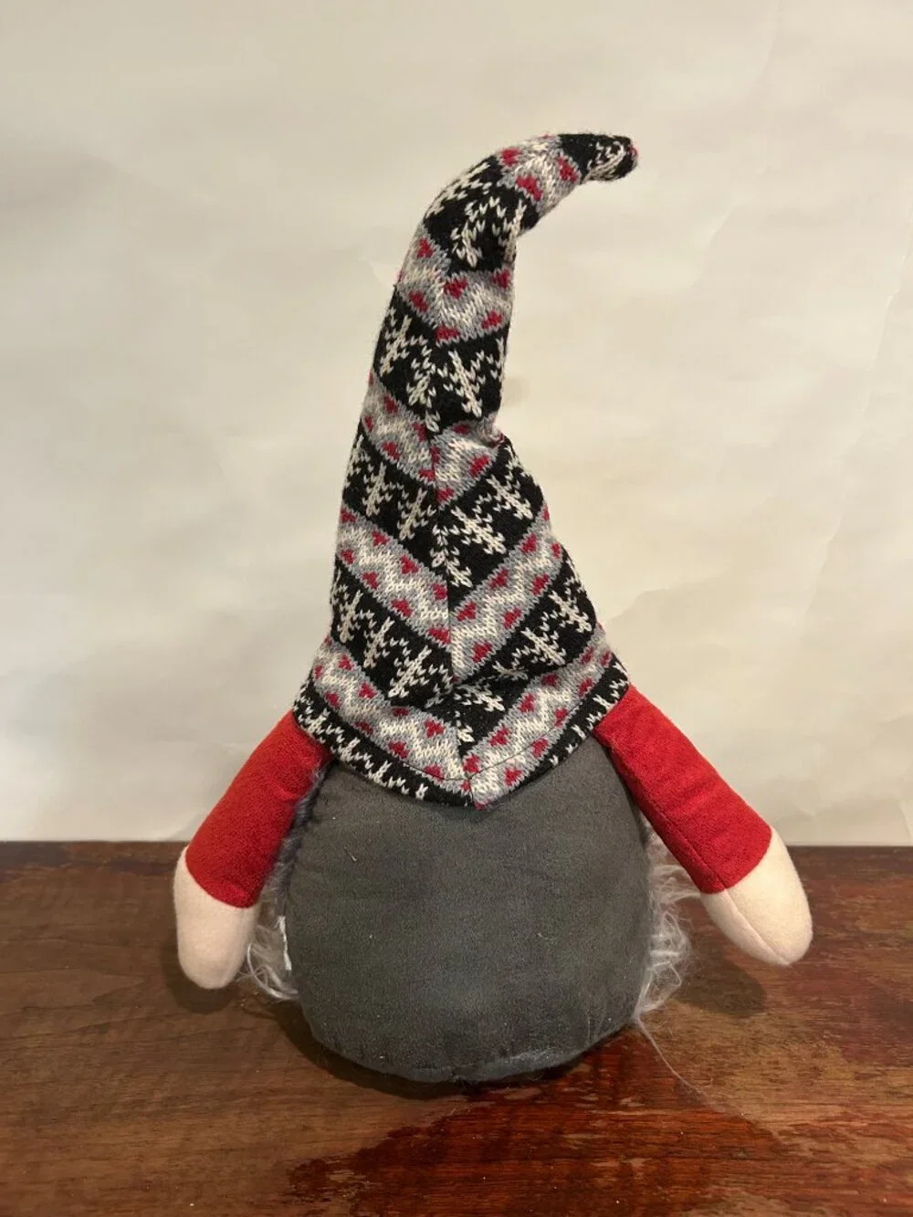 Christmas Holiday Gnome with knit cap, striped stockings and wispy gray beard